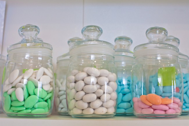   vintage drugstore glass jar with colored pills.  
