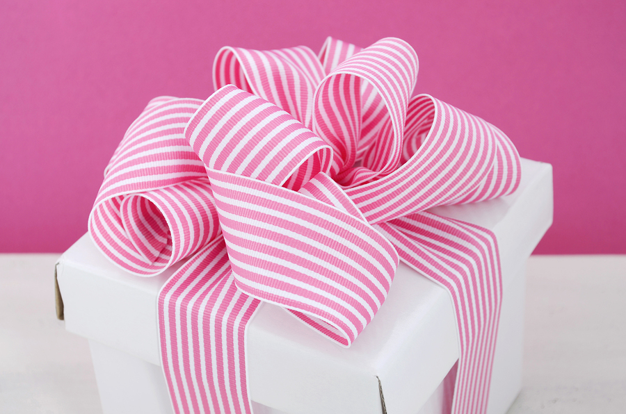   White gift box with pink stripe ribbon by Milleflore Images  