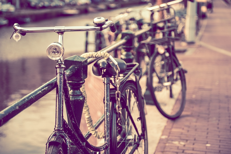  Image of secured old bikes in Amsterdam  | by  ginton    Pit stop. (Just a friendly reminder to lock up your bike, of course. Besides, we just really love this photo.)  