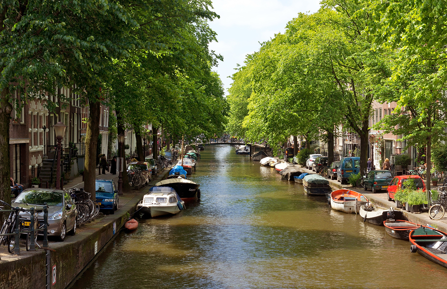  Image of Amsterdam's canals  by  Veniamin Kraskov   The canals in Amsterdam are so beautifully integrated into the city - the perfect blend of nature and urban landscape. Stop to take in the views and you might even feel a slight sea breeze. (It can happen.) 