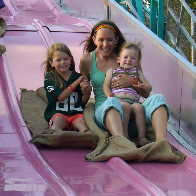 Image of Janice and children on slide. 