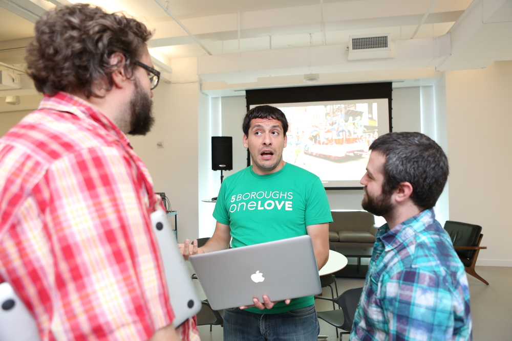   Erick (center) is a master at recruiting marchers.  Image: Alex Rodrigues 